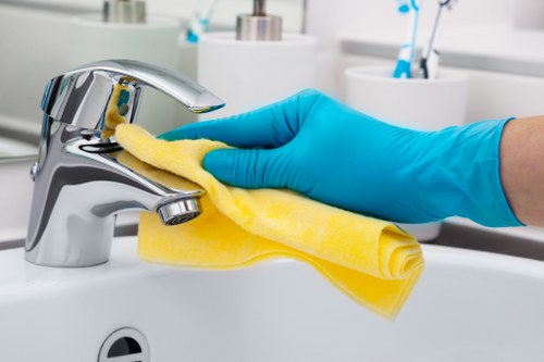Office regular cleaning on desks and shared work areas
